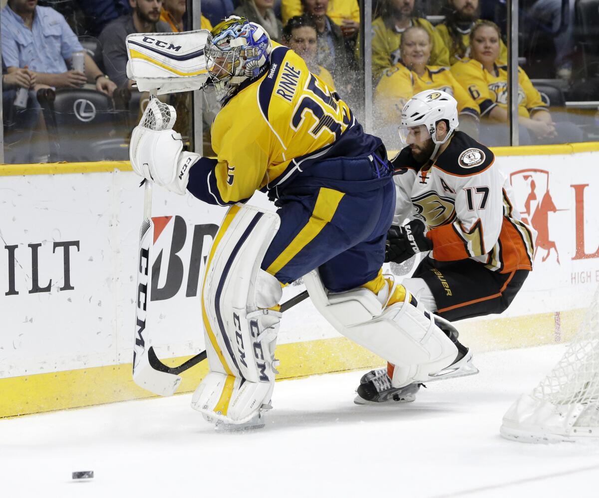 Predators goalie Pekka Rinne (35) and Ducks center Ryan Kesler (17) battle for the puck in the first period of a game on Nov. 17, 2015.