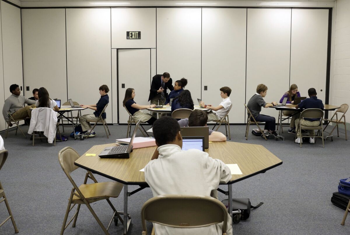 Seventh-grade students take part in a trial run of a new state assessment test on laptop computers at Annapolis Middle School in Annapolis, Md., in February.