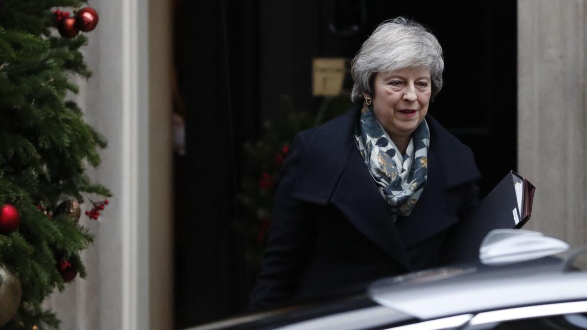 Britain's prime minister, Theresa May, leaves 10 Downing St. in London on Monday for the House of Commons to make a statement on the EU Summit held recently in Brussels.