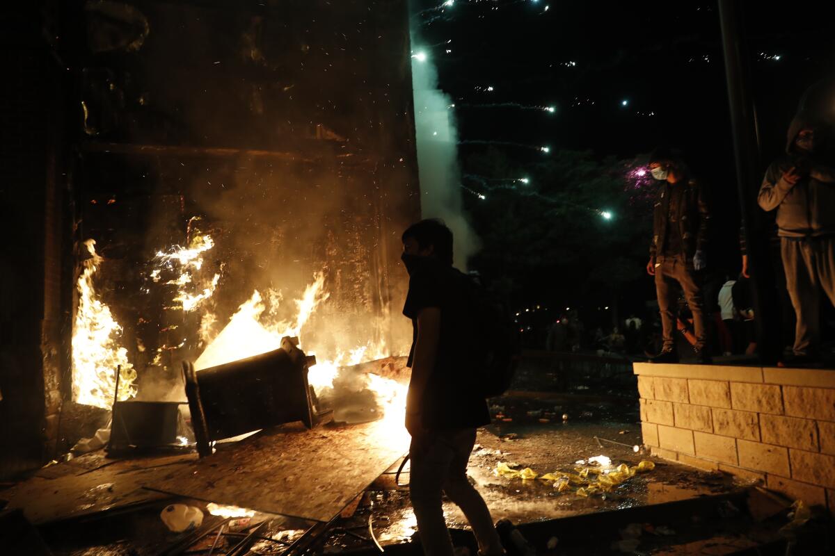 Protesters set fires at the 3rd Precinct of the Minneapolis Police Department on Thursday.