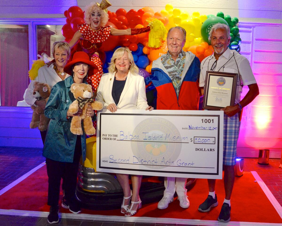 Shirley Pepys, Julia Argyros, Supervisor Katrina Foley, David Beek and Dennis Bress pose with $20,000 check given the museum.