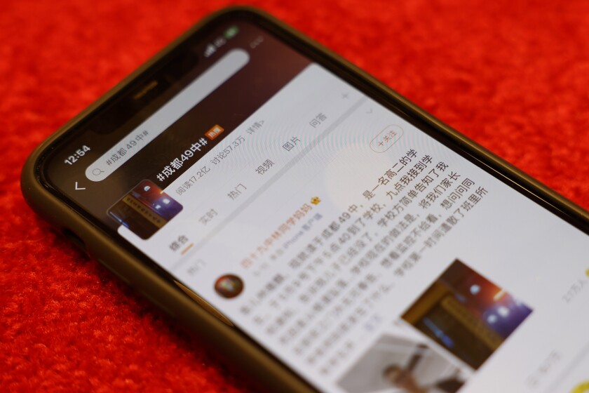 Phone displaying blog post about Chinese student's death