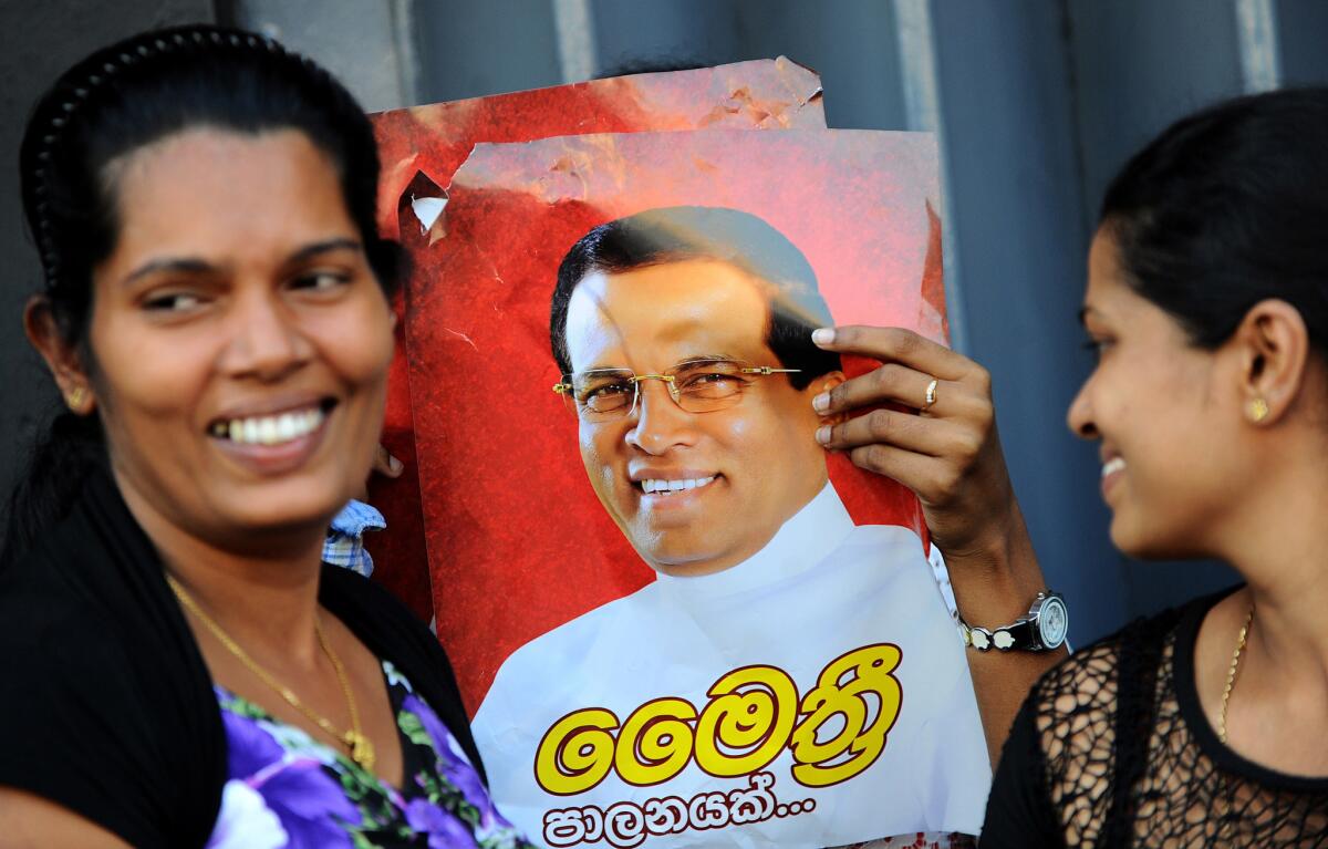 Supporters of Sri Lanka's main opposition presidential candidate, Maithripala Sirisena, celebrate after polls close in Colombo on Jan. 8.
