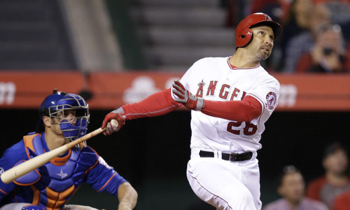 Angels designated hitter Raul Ibanez hits a three-run home run in the bottom of the ninth inning during the Angels' 7-6 loss in 13 innings to the New York Mets on Saturday.