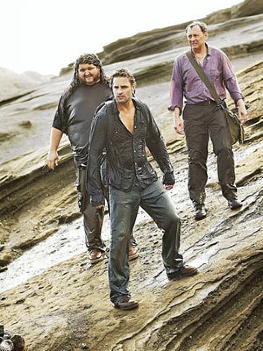 Jorge Garcia, left rear, Josh Holloway and Michael Emerson in the last episode of the ABC drama "Lost," which aired Sunday night.