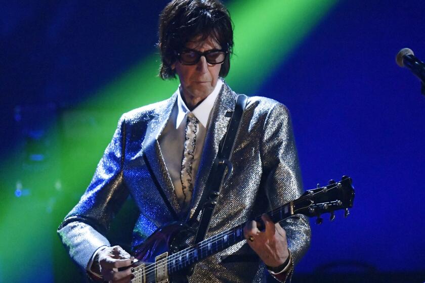 FILE - In this April 14, 2018, file photo, Ric Ocasek, from the Cars, performs during the Rock and Roll Hall of Fame Induction ceremony in Cleveland. Ocasek, famed frontman for The Cars rock band, has been found dead in a New York City apartment. The New York City police department said officers responding to a 911 call found the 75-year-old Ocasek on Sunday, Sept. 15, 2019. (AP Photo/David Richard, File)