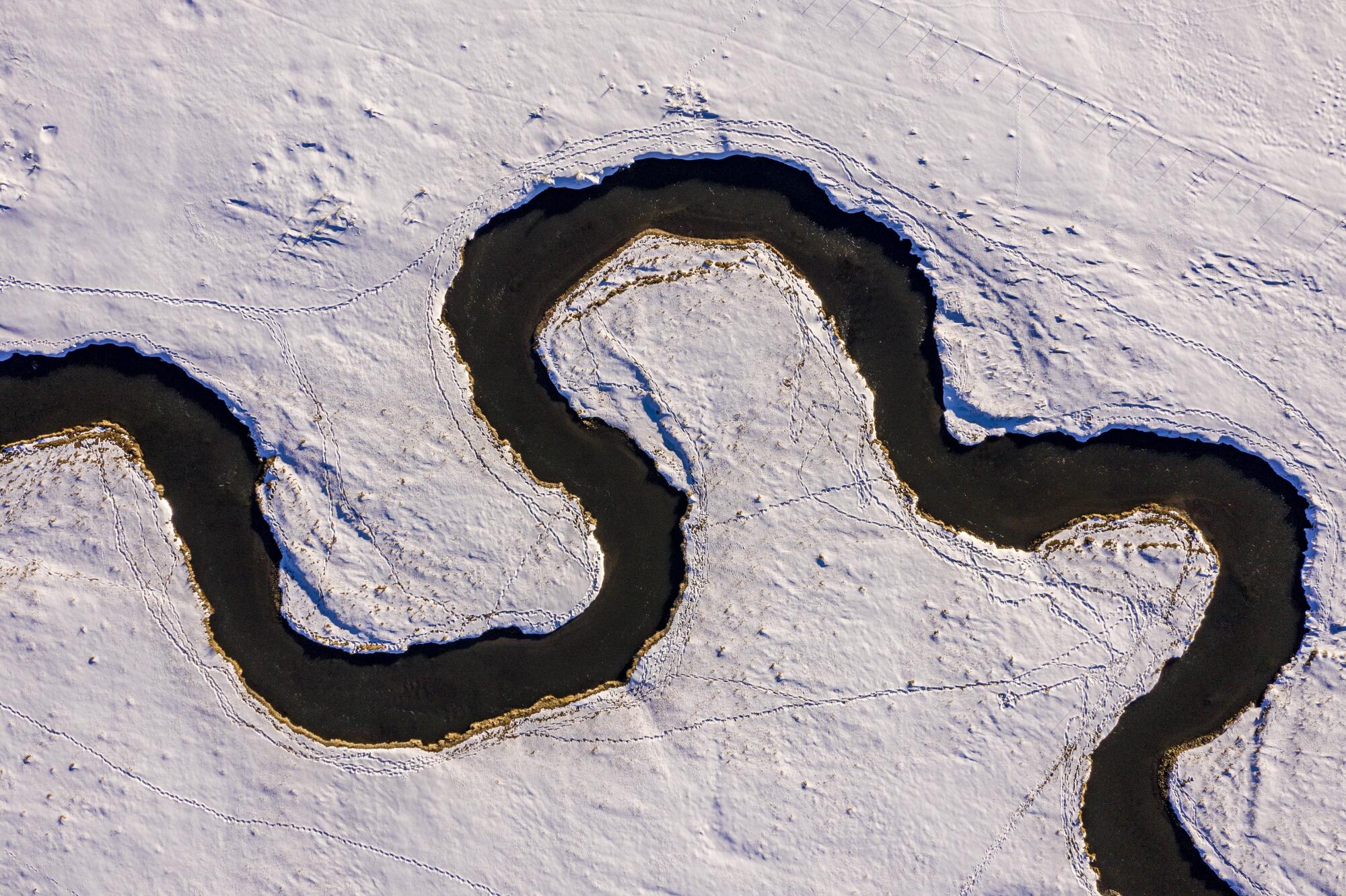 A snowy Owens River from above