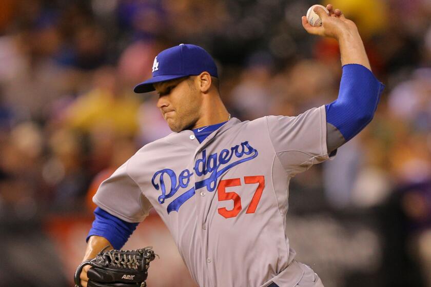 Dodgers reliever Scott Elbert delivers a pitch during a game against the Colorado Rockies on Sept. 16.