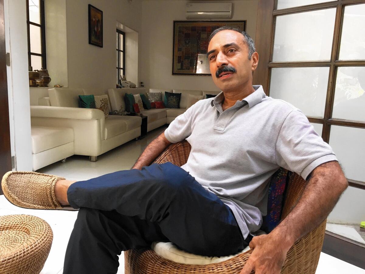 Former police official Sanjiv Bhatt, at home in Ahmedabad, India, says he's being targeted for offering evidence that could damage Prime Minister Narendra Modi in an investigation into deadly 2002 religious riots.