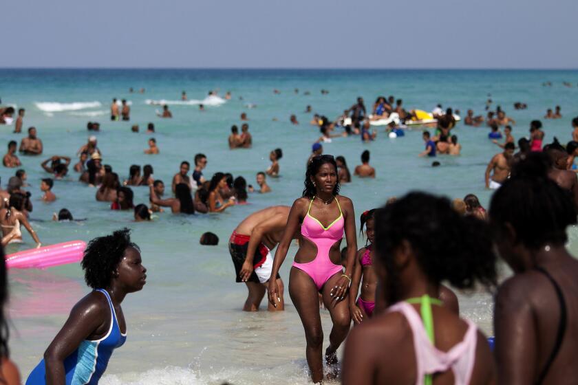 Cubans on Santa Maria del Mar beach near Havana, Cuba, on April 18, 2015. (Brian van der Brug / Los Angeles Times)