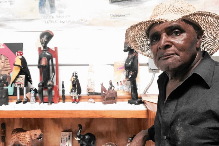 Charles Hope, who was born in Africatown, in "the den," a building that houses artifacts from the Alabama community's past.