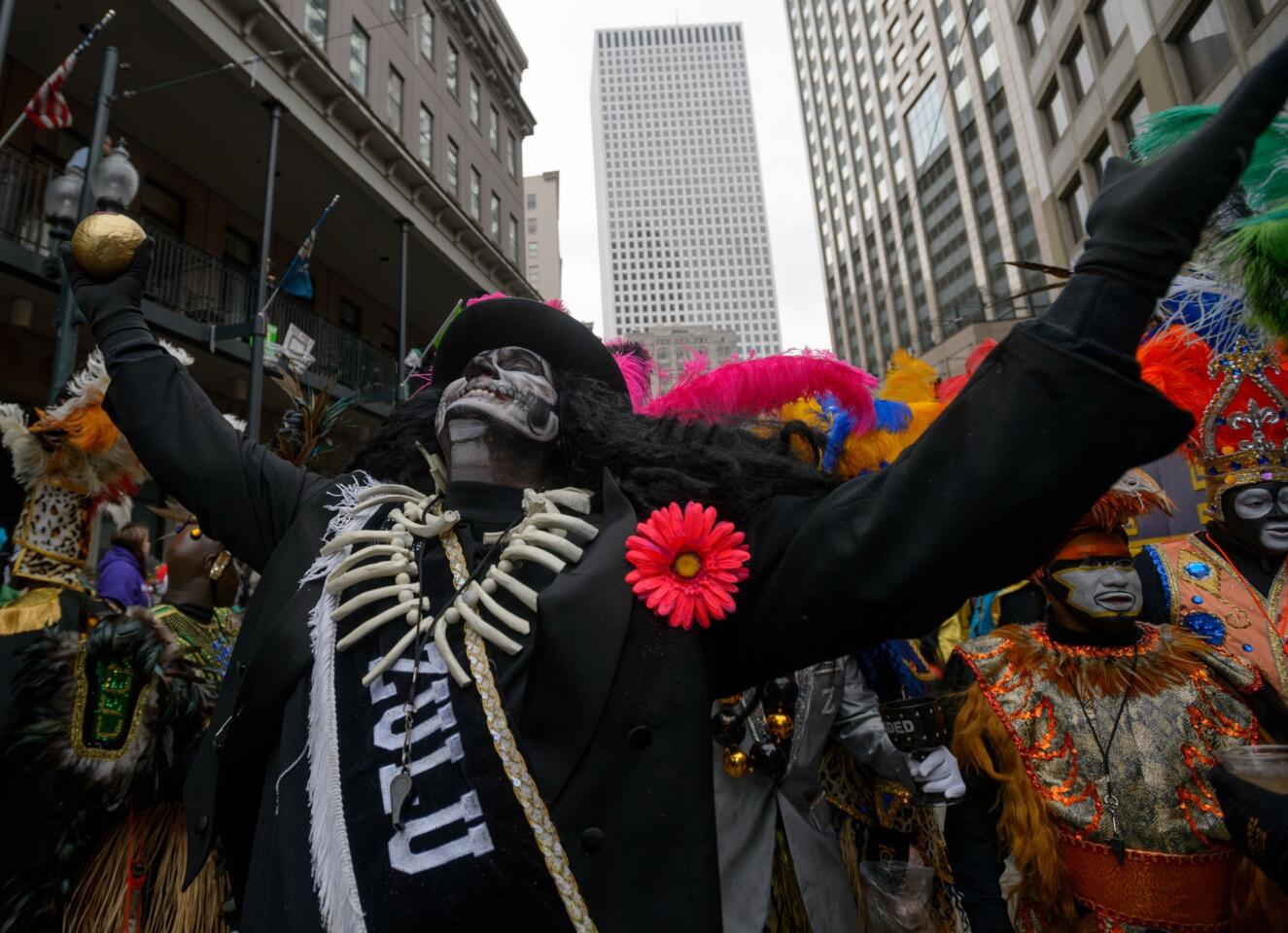 The Krewe of Zulu takes the turn onto Canal Street from St. Charles Avenue during Mardi Gras in New Orleans.