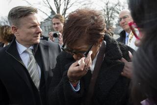 FILE - Pamela Walker, mother of Jayland Walker, who was shot and killed by police in Akron, Ohio, is comforted on Capitol Hill in Washington, on Feb. 7, 2023. (AP Photo/Cliff Owen, File)