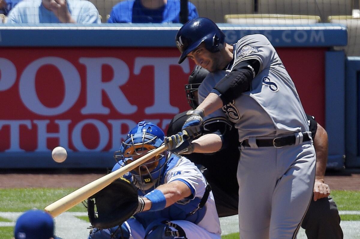 Brewers outfielder Ryan Bruan hits a solo home run against the Dodgers in the first inning.