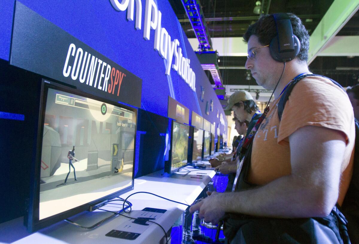The PlayStation area at last year's E3 convention in Los Angeles is shown. Sony plans to shut down its music streaming service and is partnering with Spotify to bring a new music service to PlayStation users.