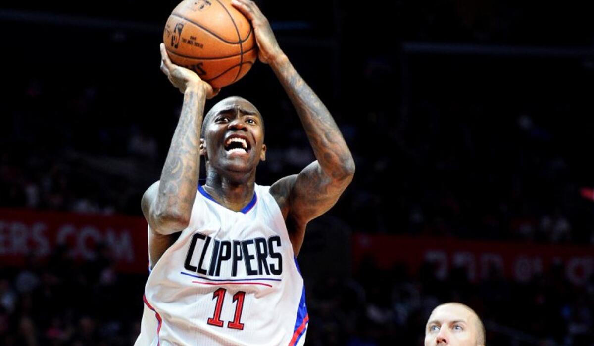 Clippers shooting guard Jamal Crawford makes a jumper over Pistons guard Steve Blake.