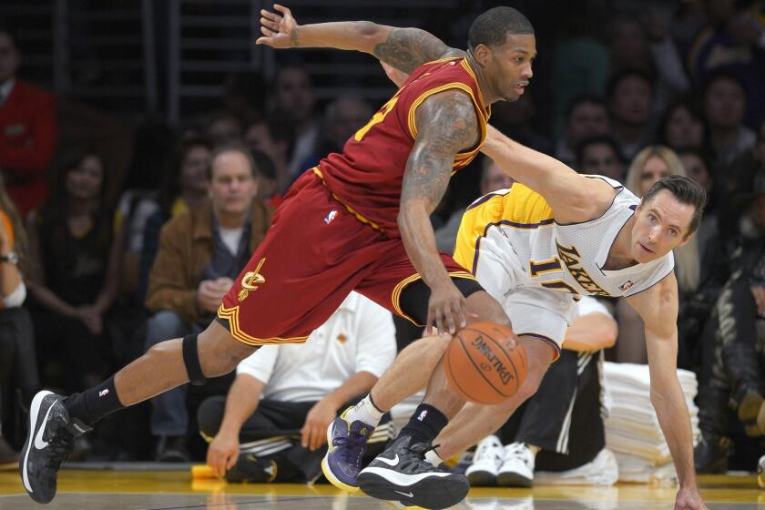 Cavaliers forward Alonzo Gee, left, drives toward the basket as Lakers guard Steve Nash defends.