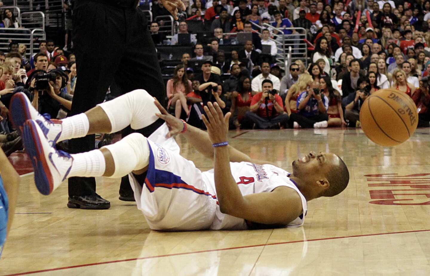 Clippers guard Randy Foye grimaces after colliding with Hornets guard Eric Gordon (not pictured) in the second half Sunday night at Staples Center.