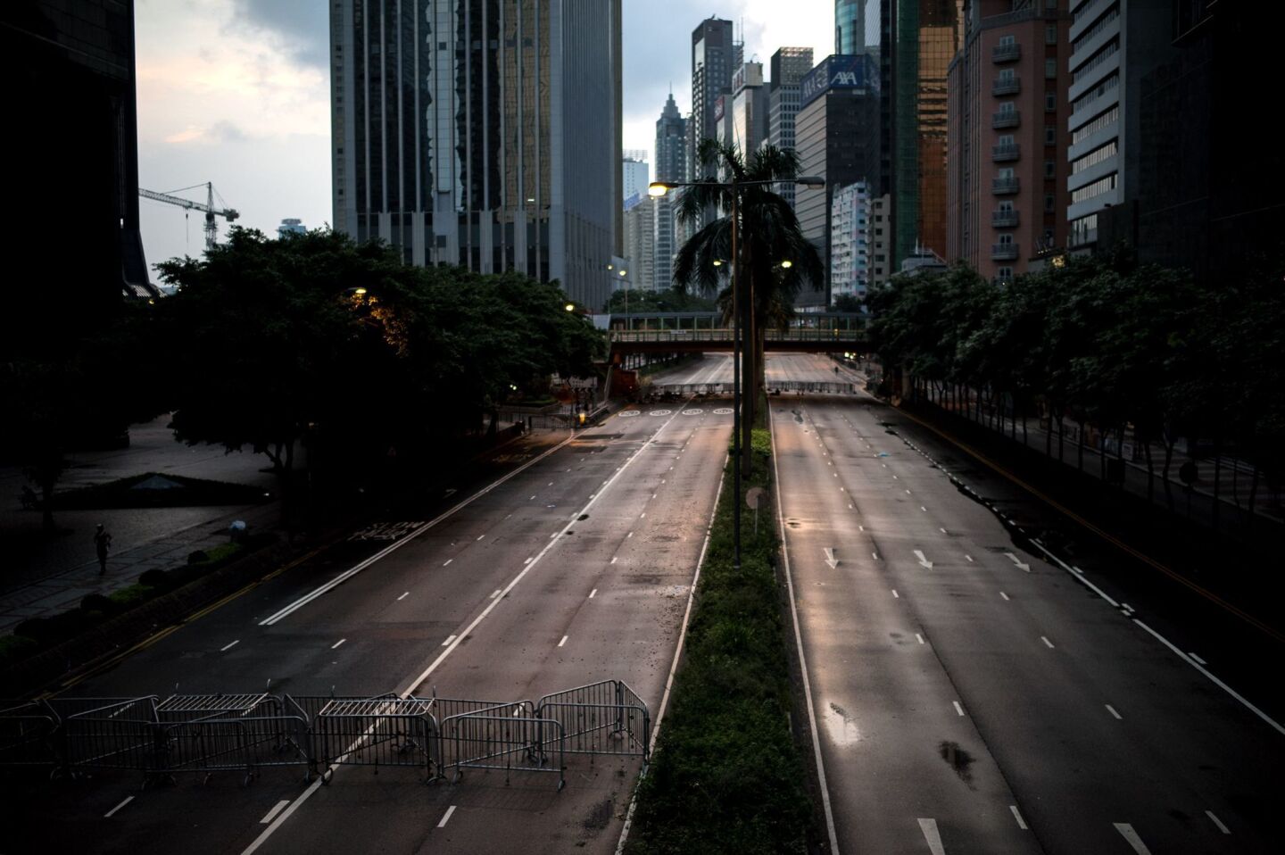 Barricades are installed to block traffic on a multilane highway as pro-democracy protests take place in Hong Kong.