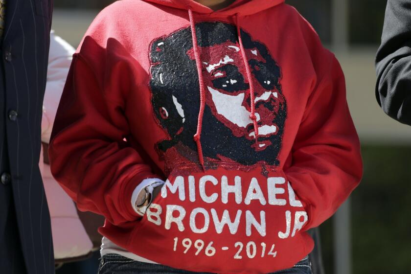 Lesley McSpadden, the mother of shooting victim Michael Brown, wears a sweatshirt in her son's memory during a news conference in April in Clayton, Mo. Brown's parents have filed a wrongful-death lawsuit against the city of Ferguson, Mo., over the fatal shooting of their son by a police officer.