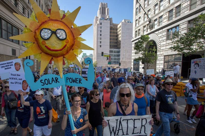 LOS ANGELES-CA-APRIL 22, 2017: People participate in the March for Science Los Angeles in Los Angeles, California, April 22, 2017. The March for Science Los Angeles is one of over 500 March for Science events happening worldwide on Earth Day. Marchers in Los Angeles include scientists, educators, students, advocates, and community leaders. (David McNew / For The Times)