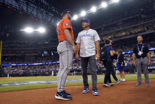 Houston Astros pitcher Justin Verlander (35) talks with former Texas Rangers' Ian Kinsler before Game 3 of the baseball American League Championship Series Wednesday, Oct. 18, 2023, in Arlington, Texas. (AP Photo/Julio Cortez)
