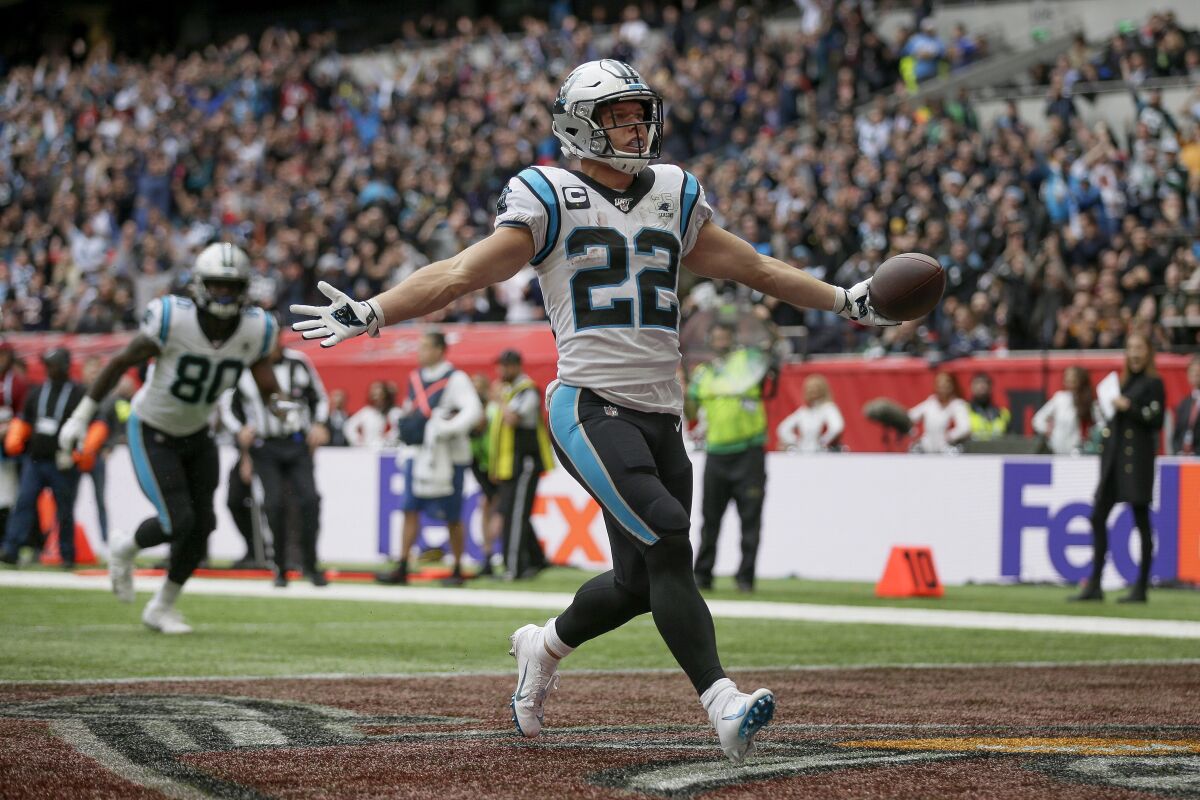 Carolina Panthers running back Christian McCaffrey reacts after scoring a touchdown against the Tampa Bay Buccaneers on Sunday.
