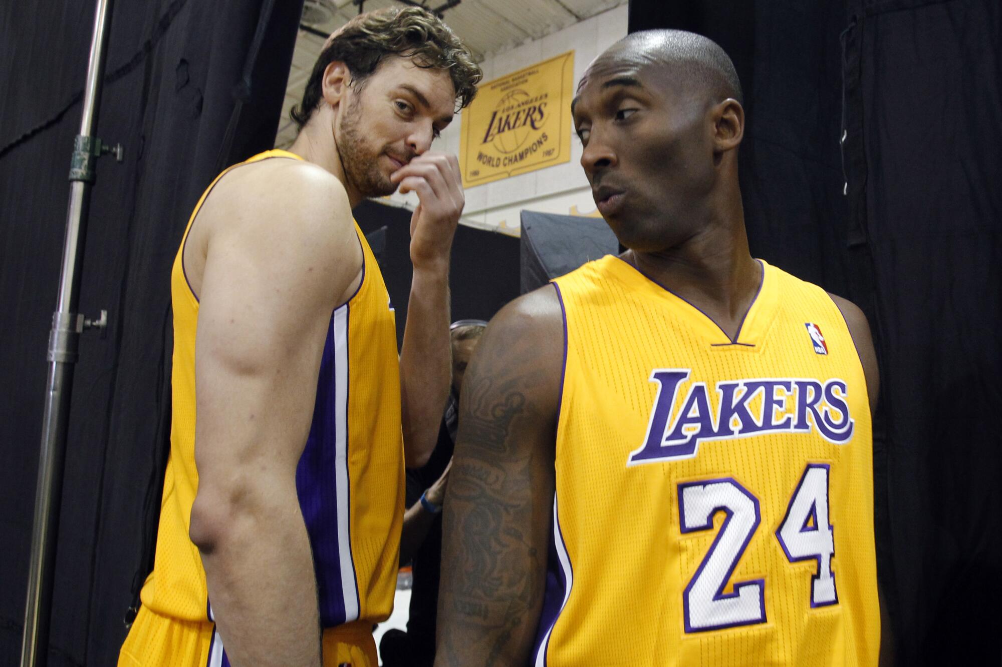 Los Angeles Lakers forward Pau Gasol, left, of Spain, stands with guard Kobe Bryant, right.