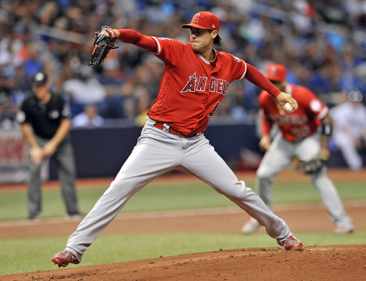FILE - Los Angeles Angels starter Tyler Skaggs pitches to a Tampa Bay Rays batter during the first inning of a baseball game July 31, 2018, in St. Petersburg, Fla. Five major league pitchers are on the government's witness list for the trial of a former Angels employee accused of providing Skaggs with the drugs that caused his overdose death. (AP Photo/Steve Nesius, File)