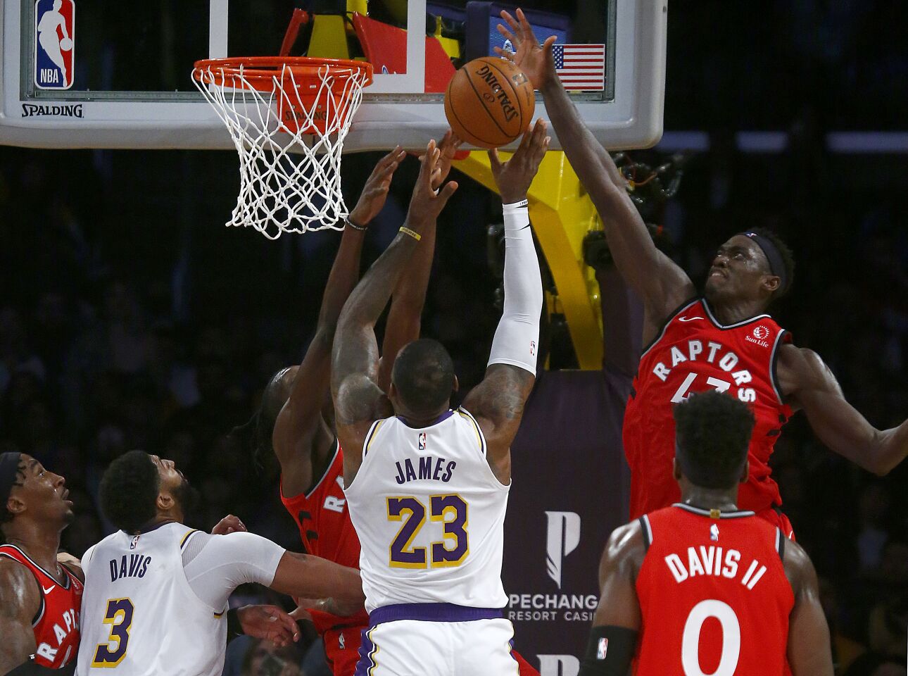 Raptors forward Pascal Siakam blocks a shot by Lakers forward LeBron James during the fourth quarter.