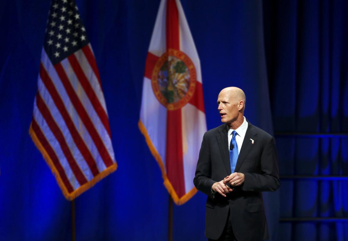 Florida Gov. Rick Scott, shown in November, has signed legislation that eliminates an 1868 state law that made it illegal for unwed couples to live together.