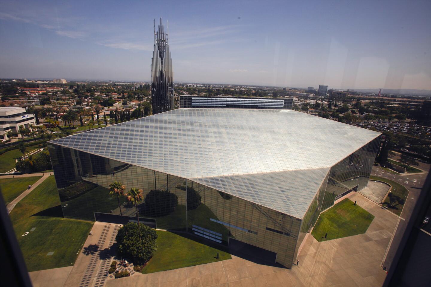 The former Crystal Cathedral in Garden Grove is being transformed into the Christ Cathedral by the Roman Catholic Diocese of Orange. The 415-foot-long cathedral, designed by famed architect Philip Johnson, is covered by about 10,000 windows and will eventually be retrofitted on the inside to accommodate traditional Catholic Church layout and rituals.