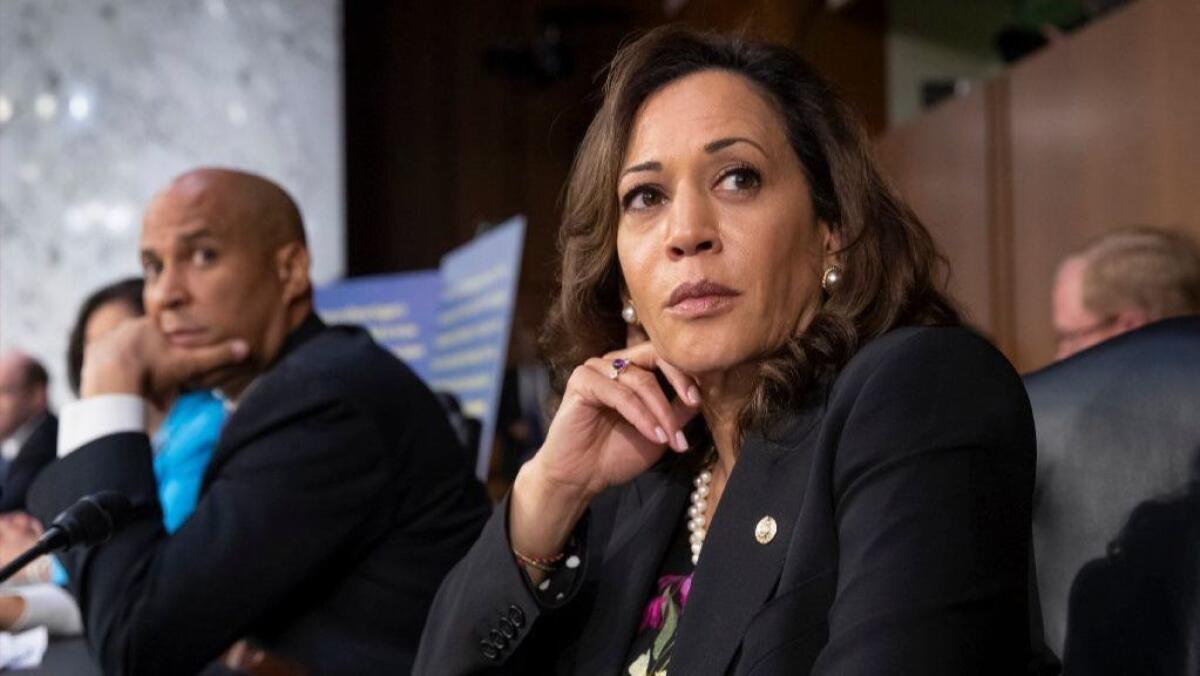 Democratic Sens. Cory Booker of New Jersey, left, and Kamala Harris of California.