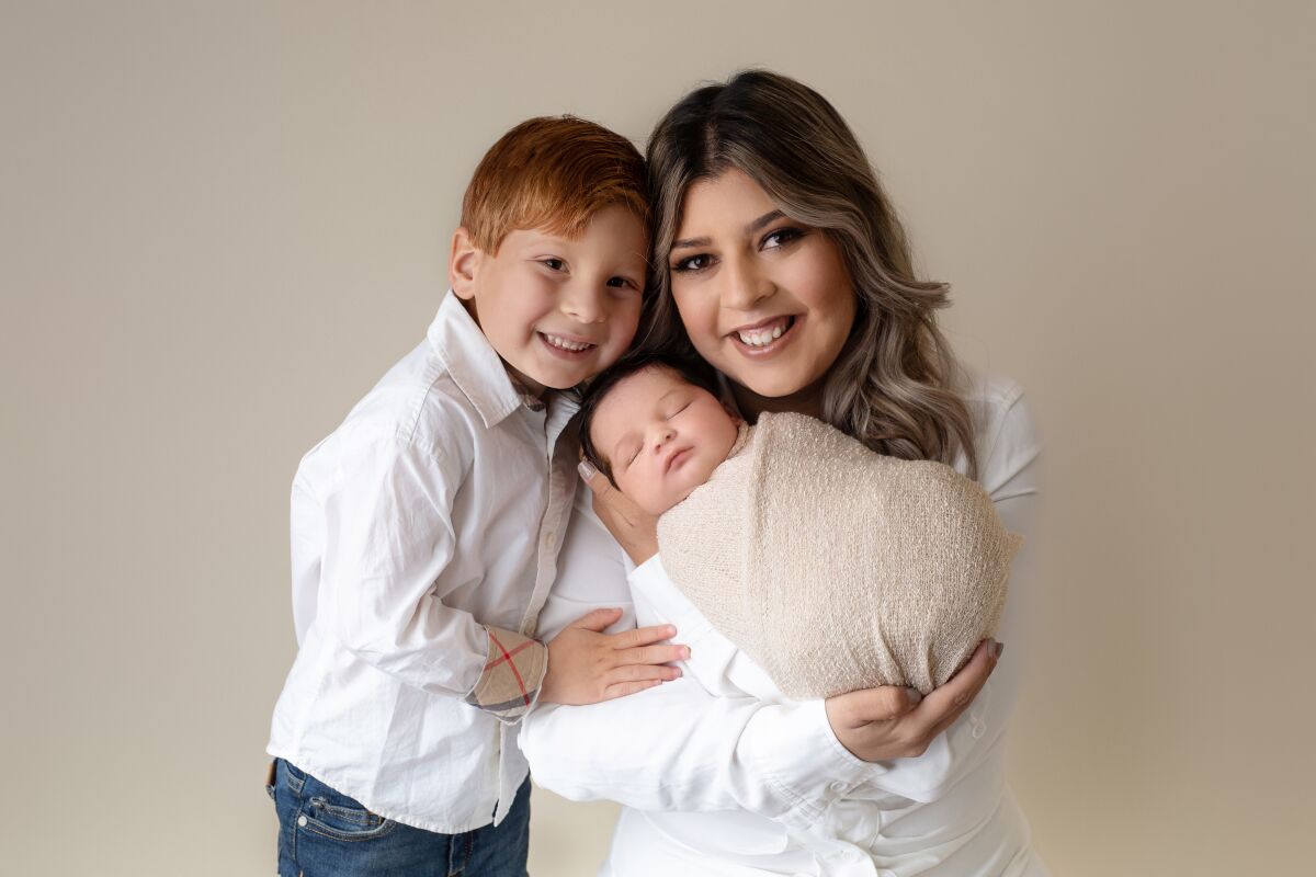 Montessori by the Sea founder Alexis Schanzlin poses with her children.