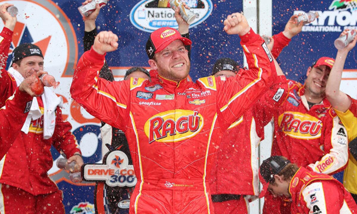 Regan Smith celebrates in victory lane after winning Saturday's NASCAR Nationwide Series race at Daytona International Speedway.