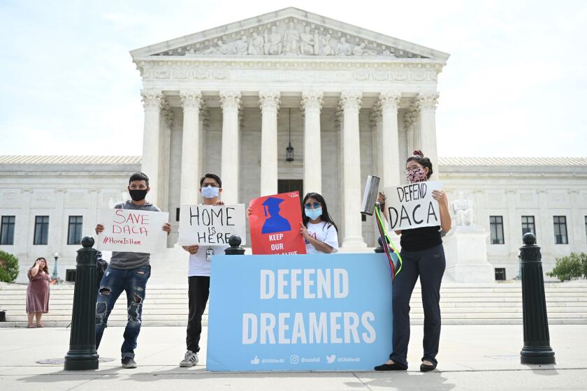 Deferred Action for Childhood Arrivals (DACA) demonstrators stand outside the US Supreme Court in Washington, DC, on June 15, 2020. (Photo by JIM WATSON / AFP) (Photo by JIM WATSON/AFP via Getty Images)