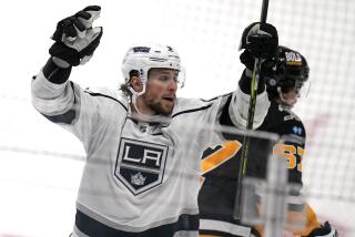 Kings forward Adrian Kempe, left, celebrates after scoring during the third period of the Kings' 2-1 comeback win.