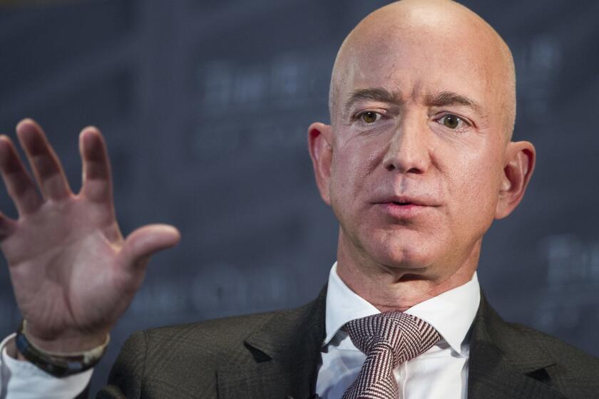 FILE - In this Sept. 13, 2018, file photo, Jeff Bezos, Amazon founder and CEO, speaks at The Economic Club of Washington's Milestone Celebration in Washington. A rich list by wealth compiler Hurun Report shows the market meltdowns in 2018 obliterated $1 trillion in wealth, with more than 212 of China's richest individuals losing their dollar billionaire status. Amazon founder Jeff Bezos led the world's wealthiest for the second year running, estimated by the Hurun Global rich list at $147 billion. (AP Photo/Cliff Owen, File)