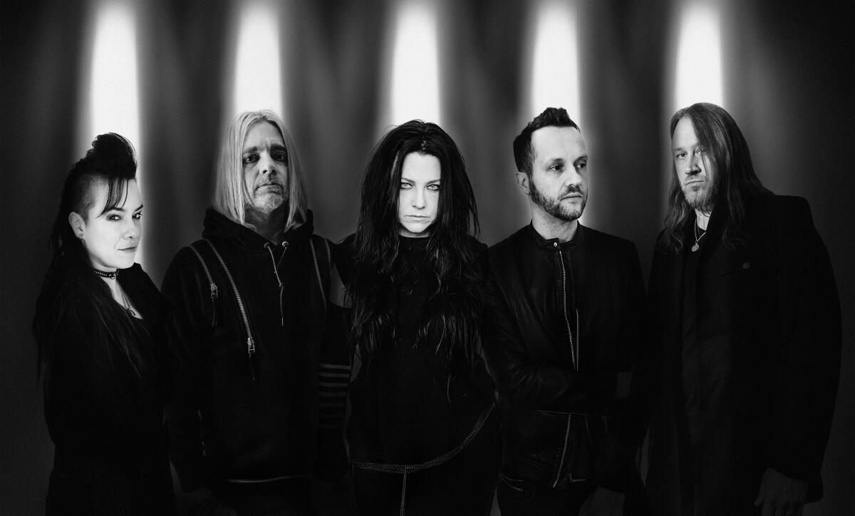 Evanescence members Jen Majura, Will Hunt, Amy Lee, Tim McCord and Troy McLawhorn.