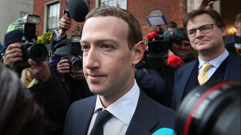 Facebook Chief Executive Mark Zuckerberg leaves a hotel in Dublin after a meeting with politicians April 2 to discuss regulation of social media and harmful content.