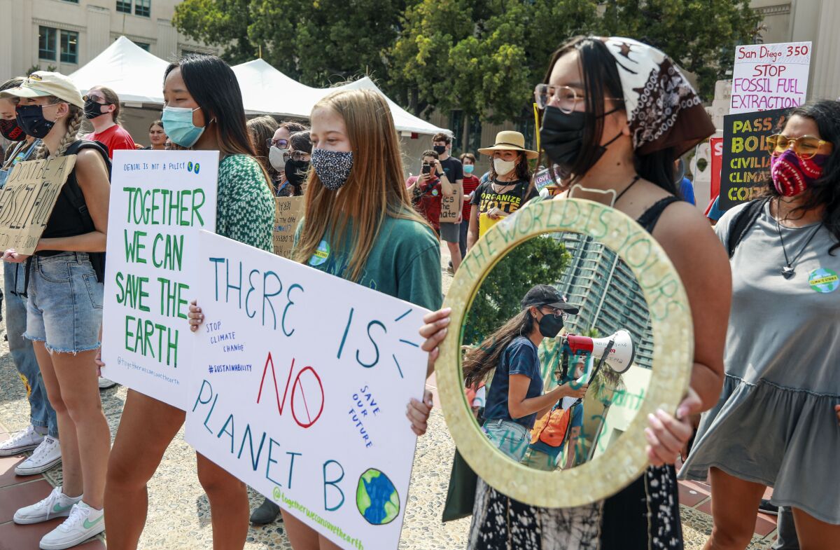 Demonstrators march in Downtown San Diego during climate rally on Friday, September 24, 2021. 