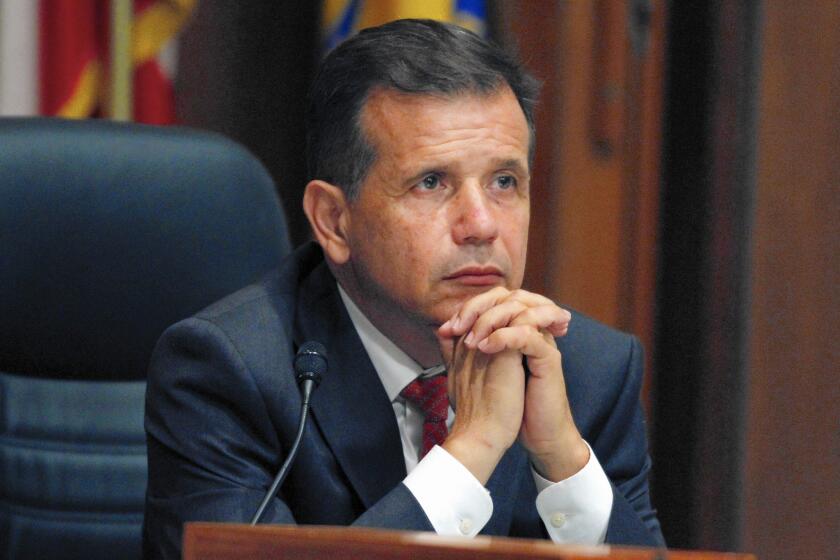 Santa Ana Mayor Miguel Pulido is under investigation for a 2010 real estate deal. Voters handed him an 11th consecutive term in this month's election.