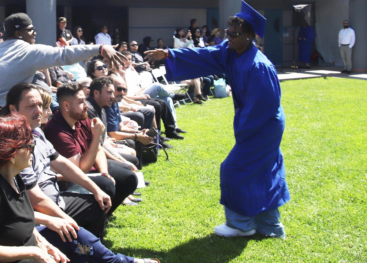 Valley Vista graduate Haston Allen receives congratulations from loves ones during a commencement ceremony on Thursday.