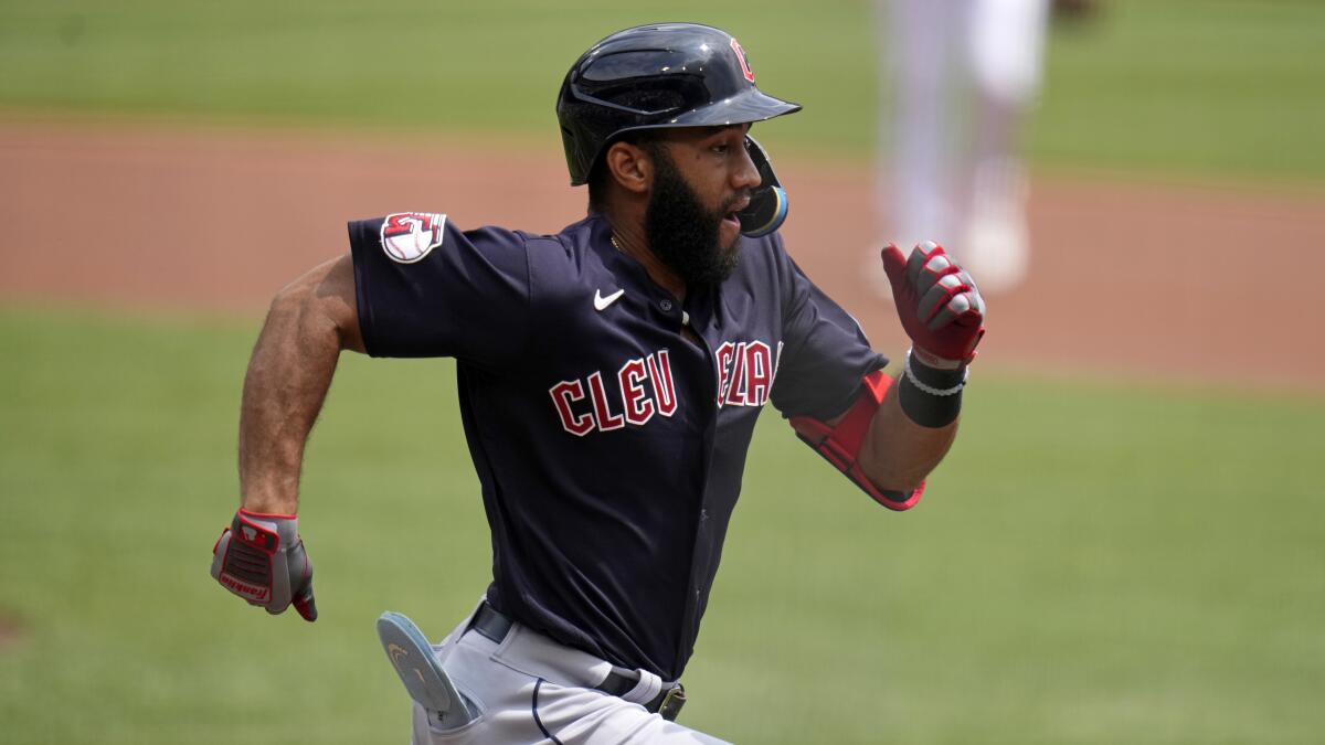 Cleveland Guardians' shortstop Amed Rosario runs to first base