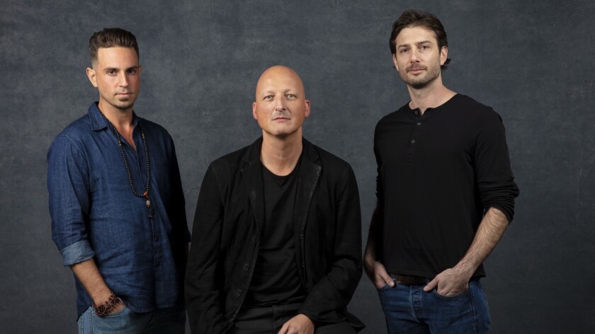 "Leaving Neverland" director Dan Reed, center, with Michael Jackson accusers Wade Robson, left, and James Safechuck photographed at the 2019 Sundance Film Festival in Park City, Utah, in January.