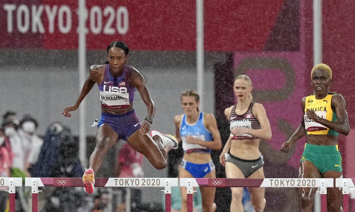 Dalilah Muhammad of the United States races to win a heat in the women's 400-meter hurdles.