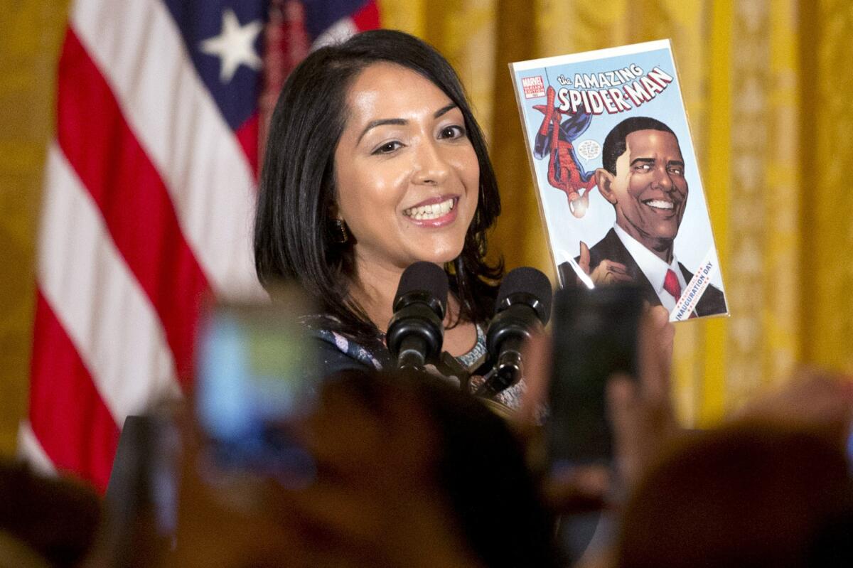 Ms. Marvel co-creator Sana Amanat holds up an issue of "The Amazing Spider-Man" featuring President Obama at a reception for Women’s History Month at the White House on March 16.