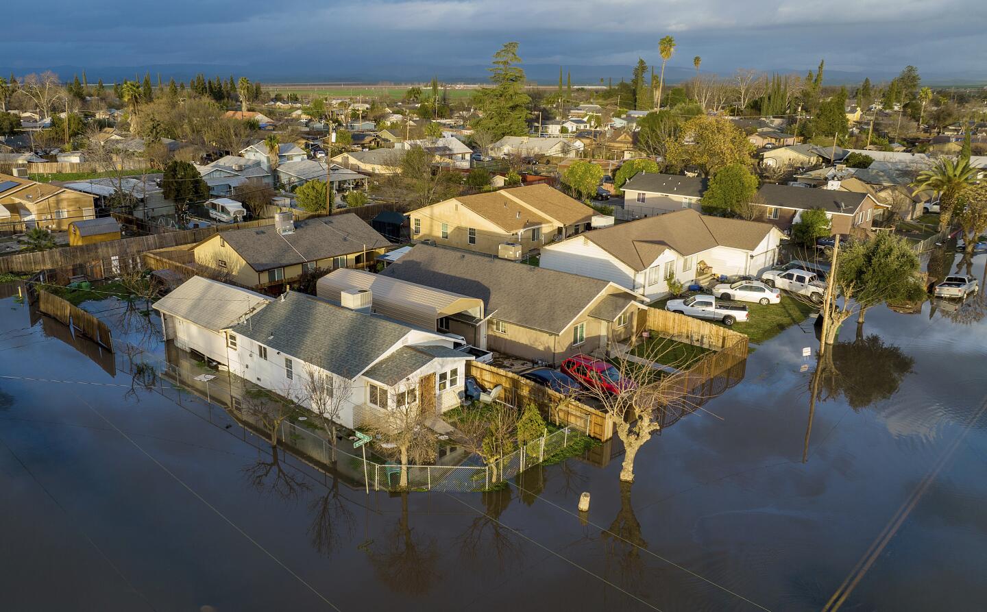 Floodwaters cover streets in the Planada community of Merced County