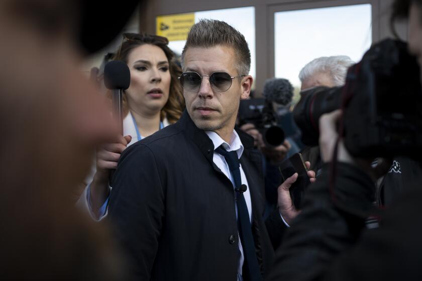 Former Hungarian government insider Peter Magyar arrives at Public Prosecutor's office in Budapest, Hungary on Tuesday March 26, 2024. Magyar published an audio recording on Tuesday that he says is proof of official misconduct within high levels of the government of populist Minister Viktor Orbán. (AP Photo/Denes Erdos)