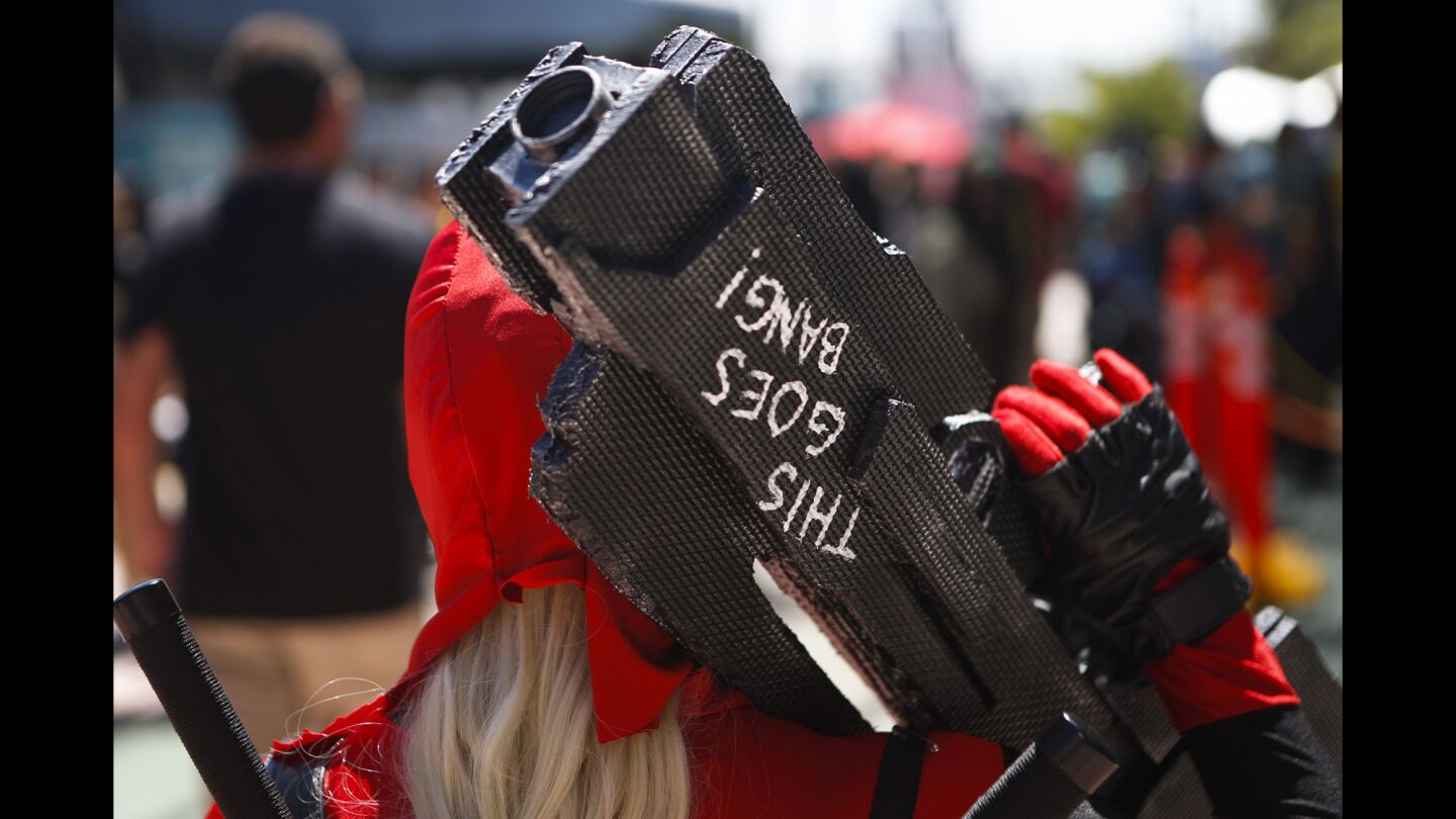 A cosplayer stands outside of the San Diego Convention Center during the second day of Comic-Con.